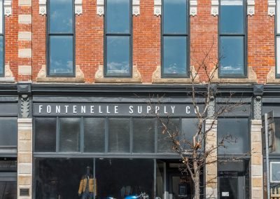 Fontenelle supply company street view with historic brick structure and window