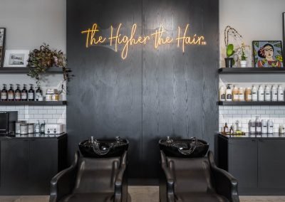 R. Mane Apothecary "The Higher the Hair" sign