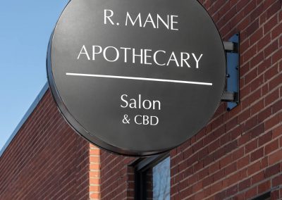 R. Mane Apothecary Salon and Services outdoor sign