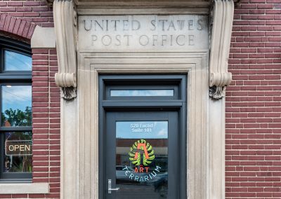 Art Terrarium front door with historic united states post office sign